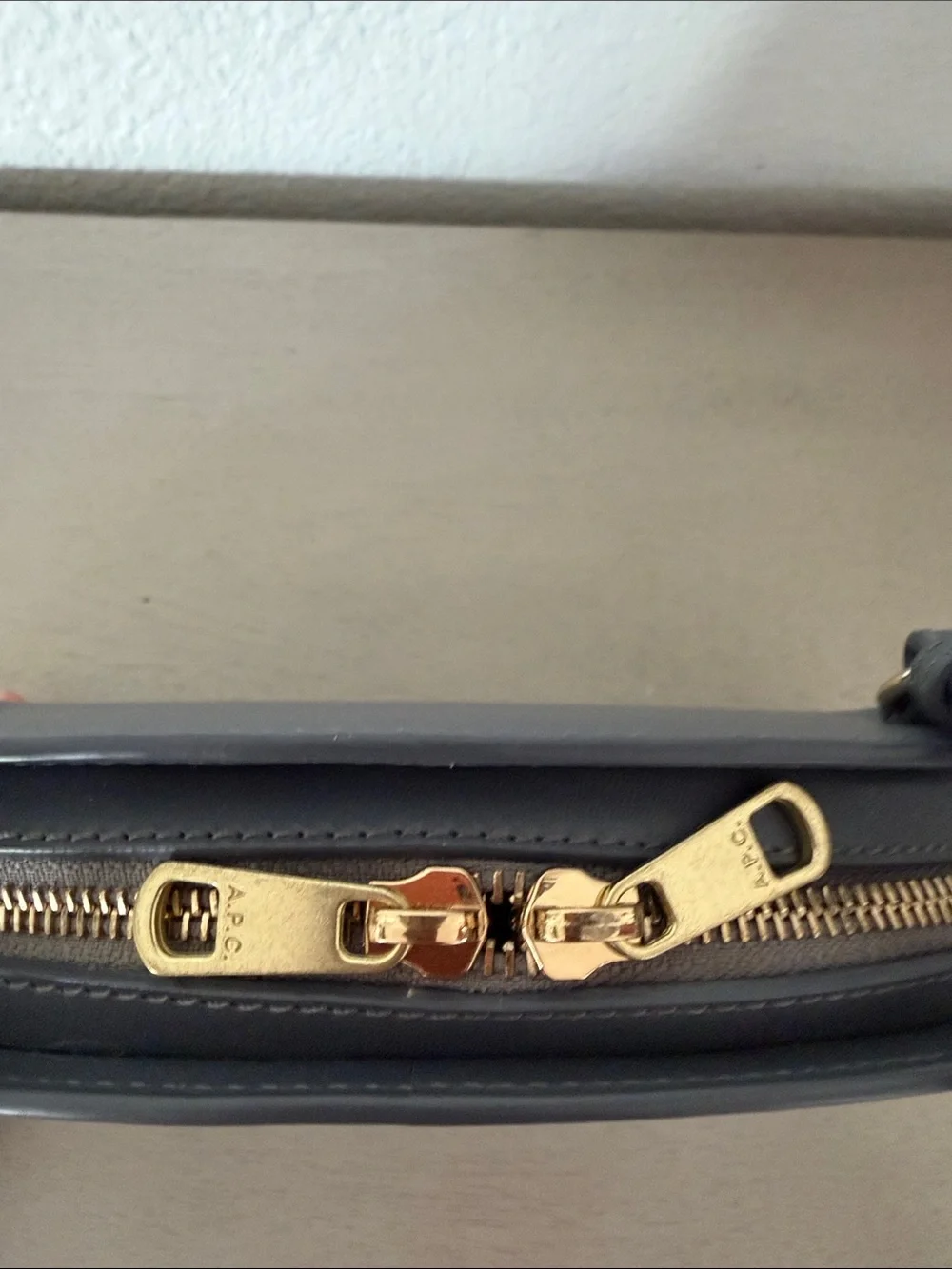 A.P.C. Half-Moon Leather Crossbody Bag in Black with Gold Logo